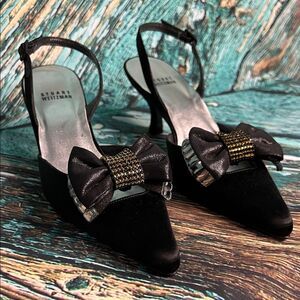 Stuart Weitzman black satin slingback heels with a bow